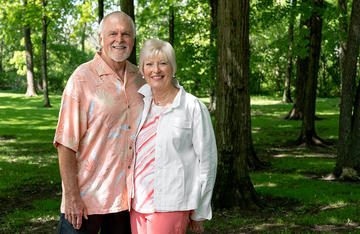 Couple posing for photo in the woods